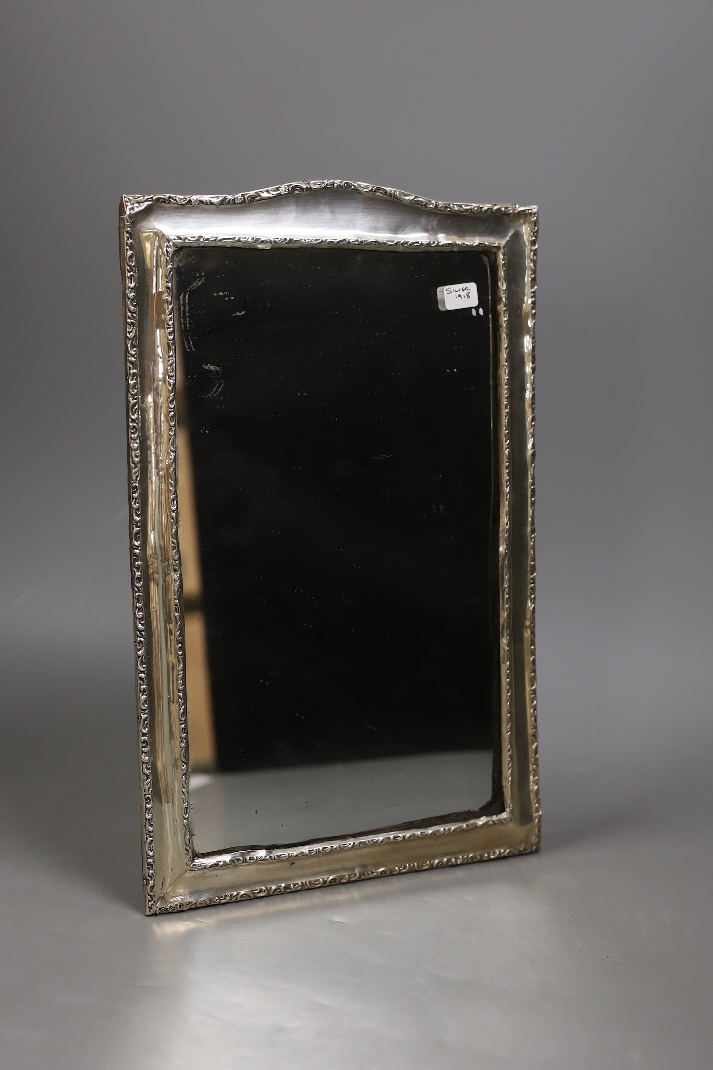 An Edwardian silver mounted rectangular photograph frame, Henry Matthews, Birmingham, 1909, 33.2cm.